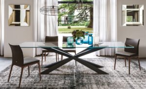 Spyder table design en verre avec base en bois sculpté signée Cattelan Italia, un équilibre parfait entre légèreté et élégance. Disponible chez D-Style Interior.