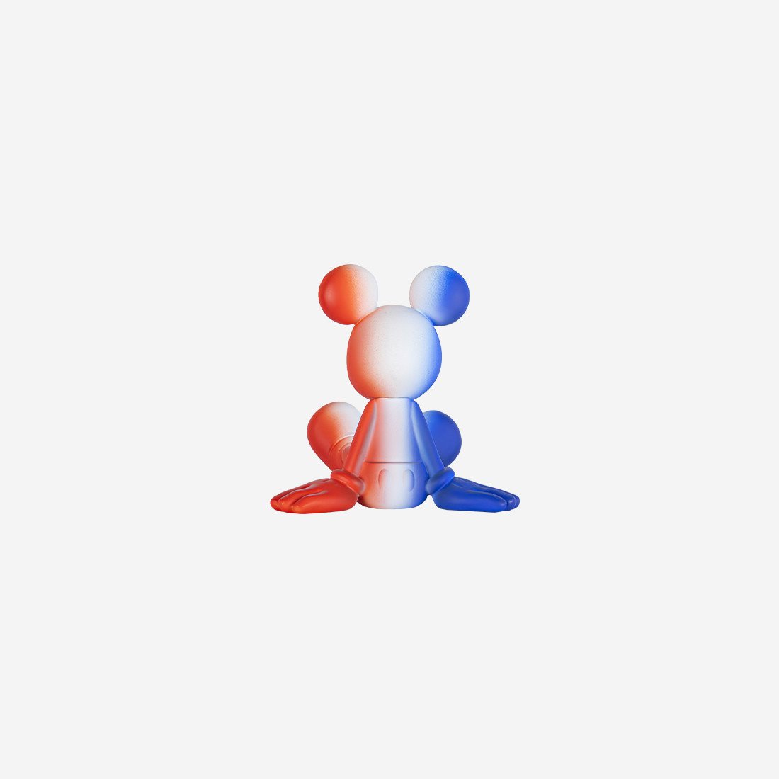 Sitting Mickey Dégradé Extra Small, sculpture design haut de gamme par Leblon Delienne et Marcel Wanders, en dégradé bleu blanc rouge. Disponible chez D-Style Interior