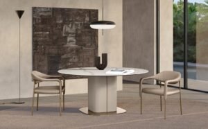 Milos table à manger de Gamma Arredamenti associe cuir, bois courbé et plateau en marbre, verre ou céramique. Élégance italienne disponible chez D-Style Interior.